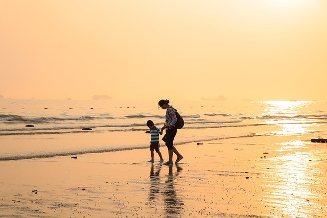 mother in ocean with her daughter