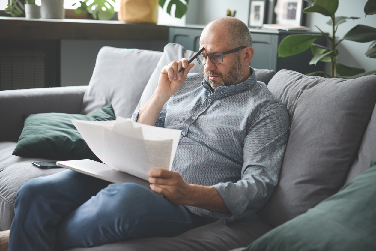 man-going-through-paperwork