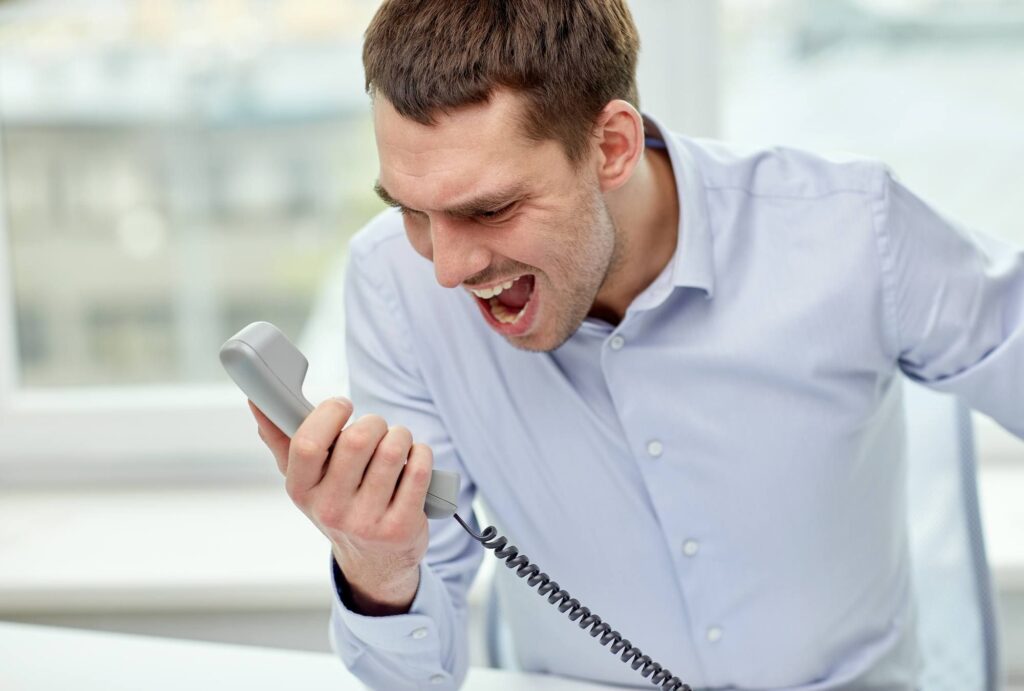 a man yelling into a phone