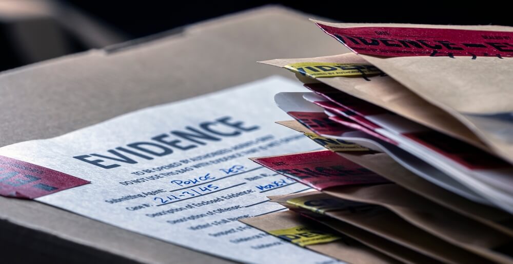 A desk adorned with a box of evidence demonstrating ways for a father to obtain full custody in Texas.