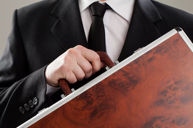 male lawyer holding money suitcase in black dress