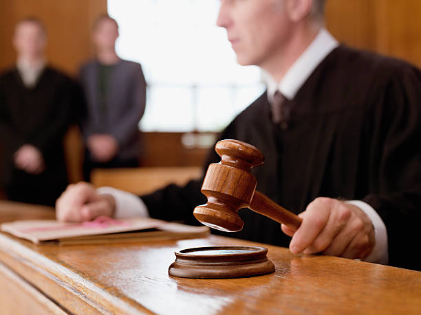 Judge in court and gravel for justice