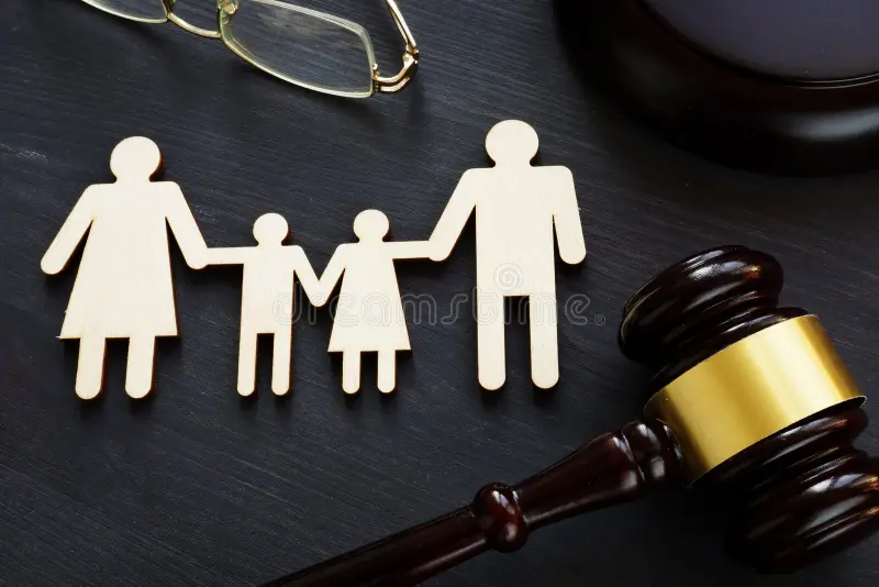 A wooden family with glasses on a table stock photos.