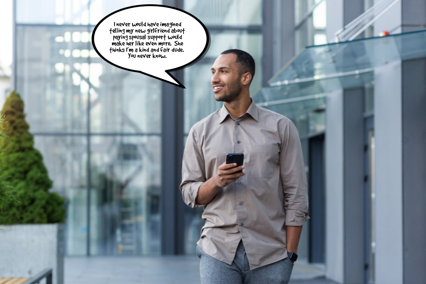 A man holding a cell phone with a speech bubble.