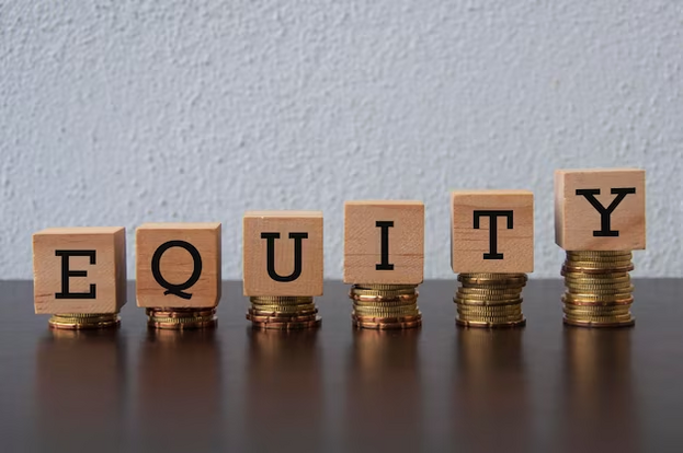 A stack of wooden blocks spelling out the word equity.
