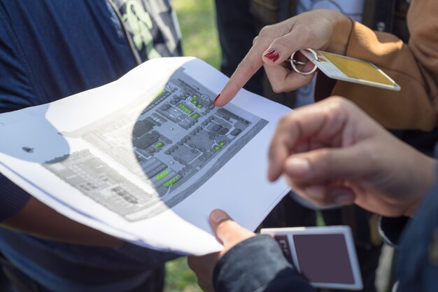 A group of people looking at a map.