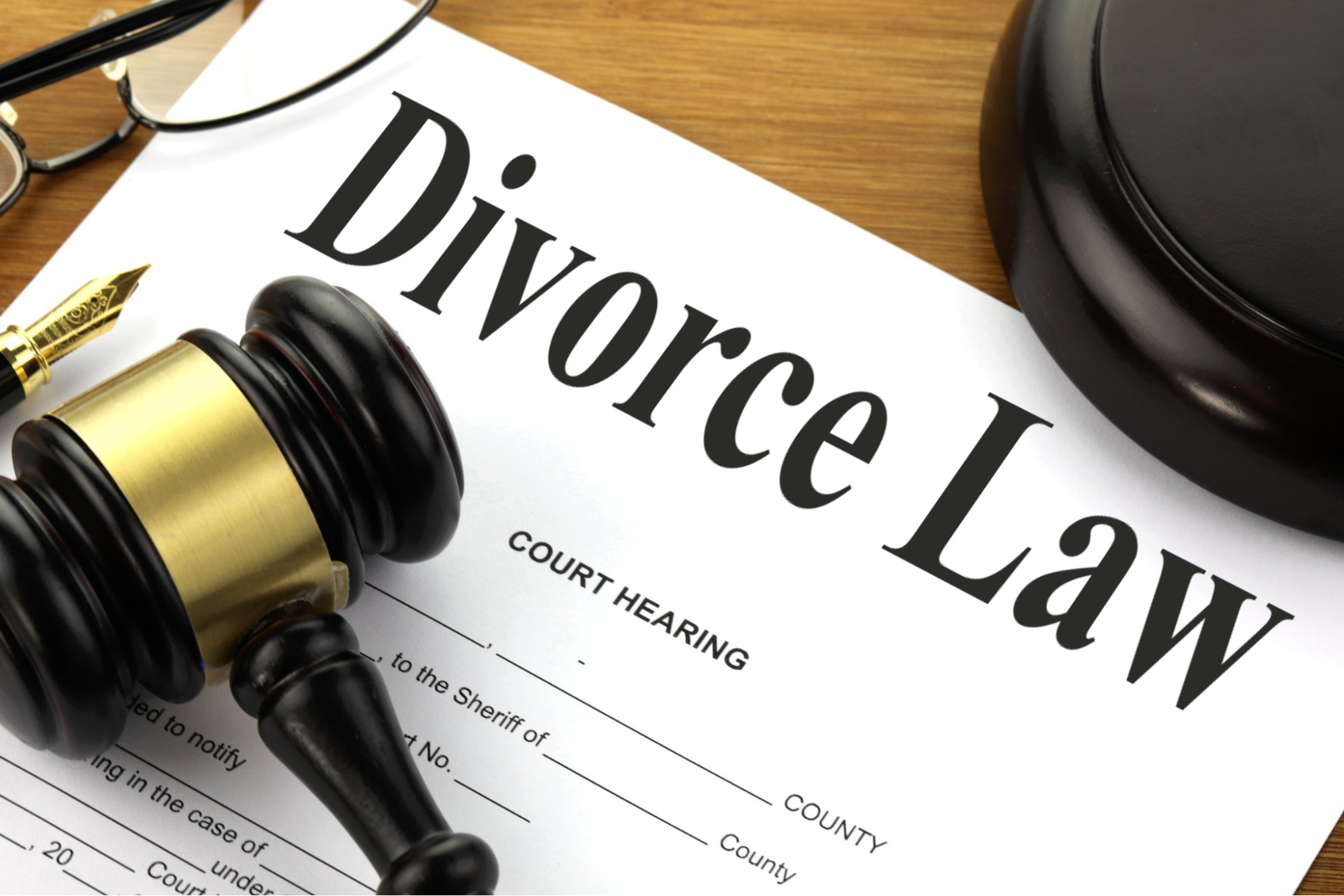 A divorce law document with a gavel on top and the possibility of emptying a personal bank account before divorce.