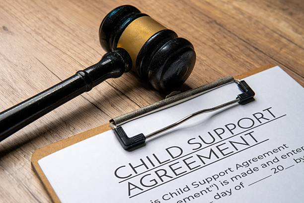 A gavel on a child support agreement document. Legal concept.