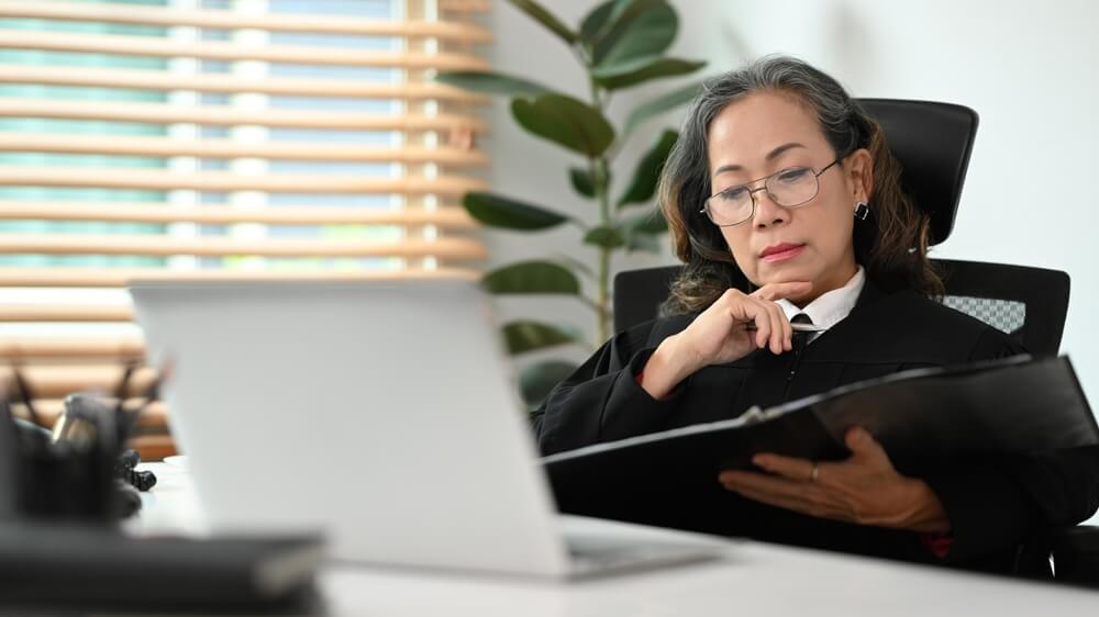 Female judge looking over information at her desk