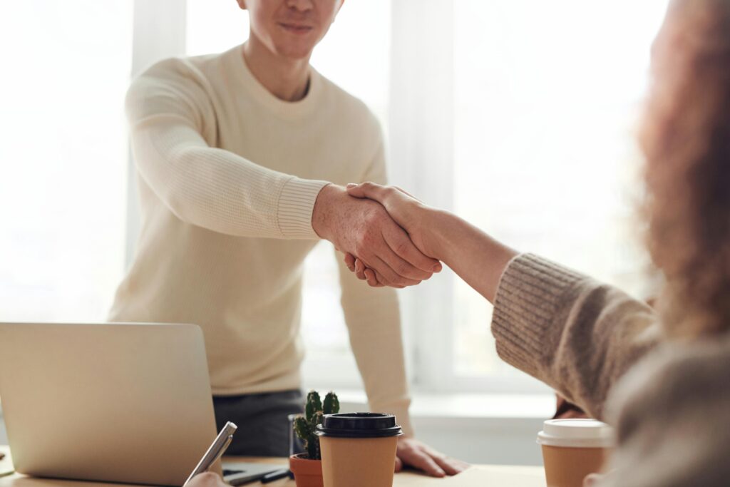 Man shaking hand of lawyer of his choice