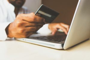man-using-credit-card-online