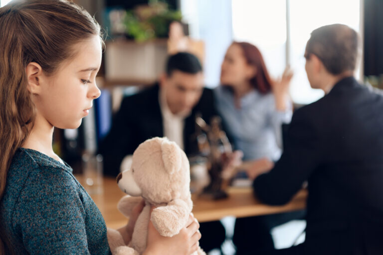 Young couple arranges guardianship of little girl. Registration of guardianship. Family in office of family lawyer. Two parents fighting over child in divorce concept.