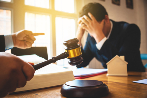 Businessman feels stressed when filed for bankruptcy, bankruptcy and execution concept. what happens if a debt collector takes you to court