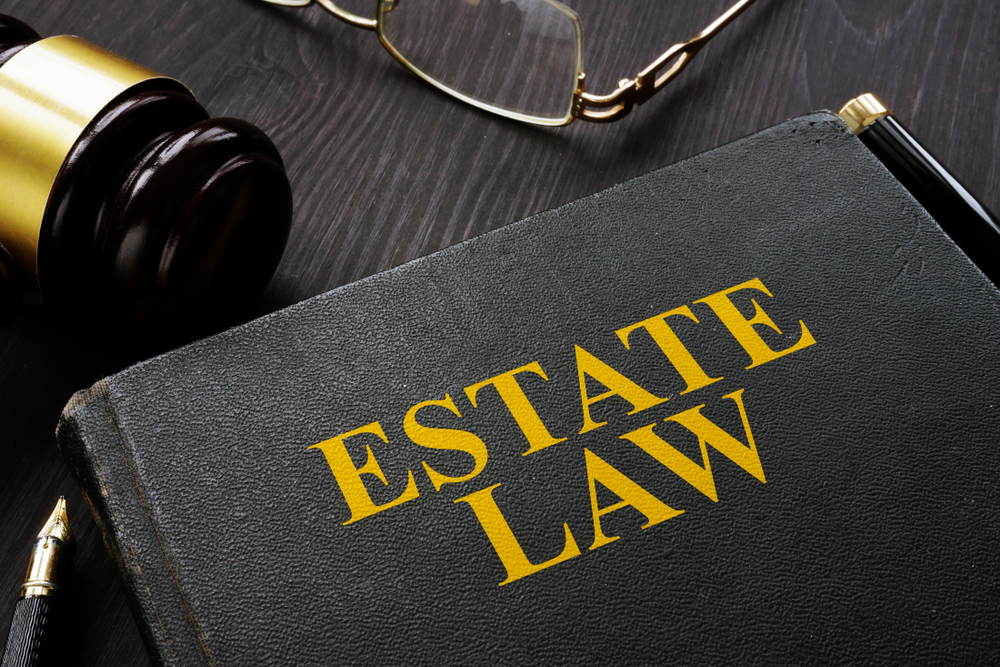 Book estate law and gavel on a table. how to get power of attorney for elderly parent