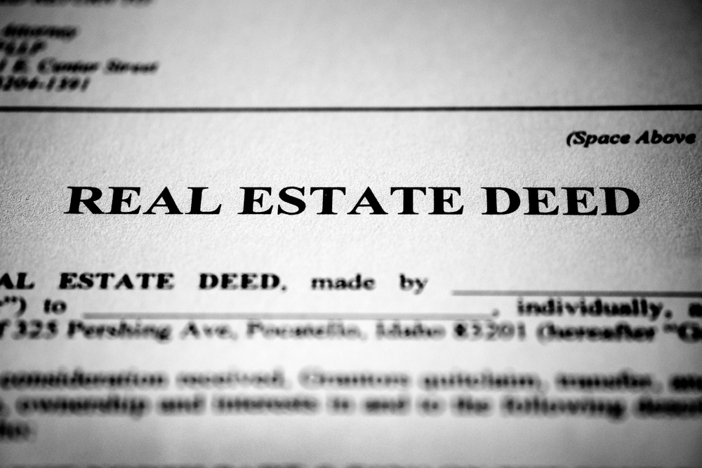 Real estate deed to transfer ownership of land or property