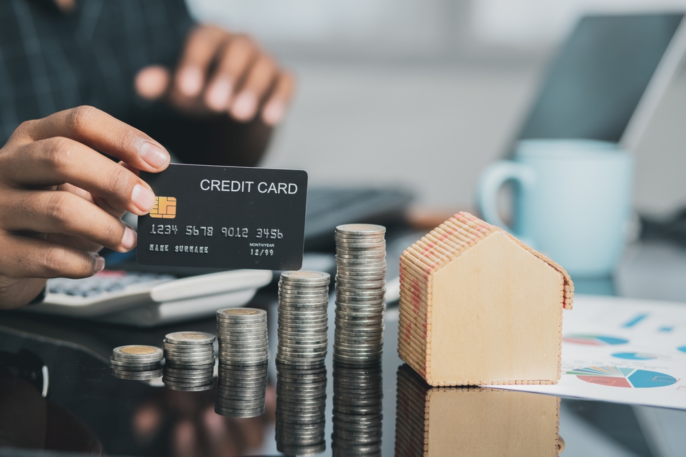 Businessman planning career investment Loan and home ideas are approved with credit card limits.