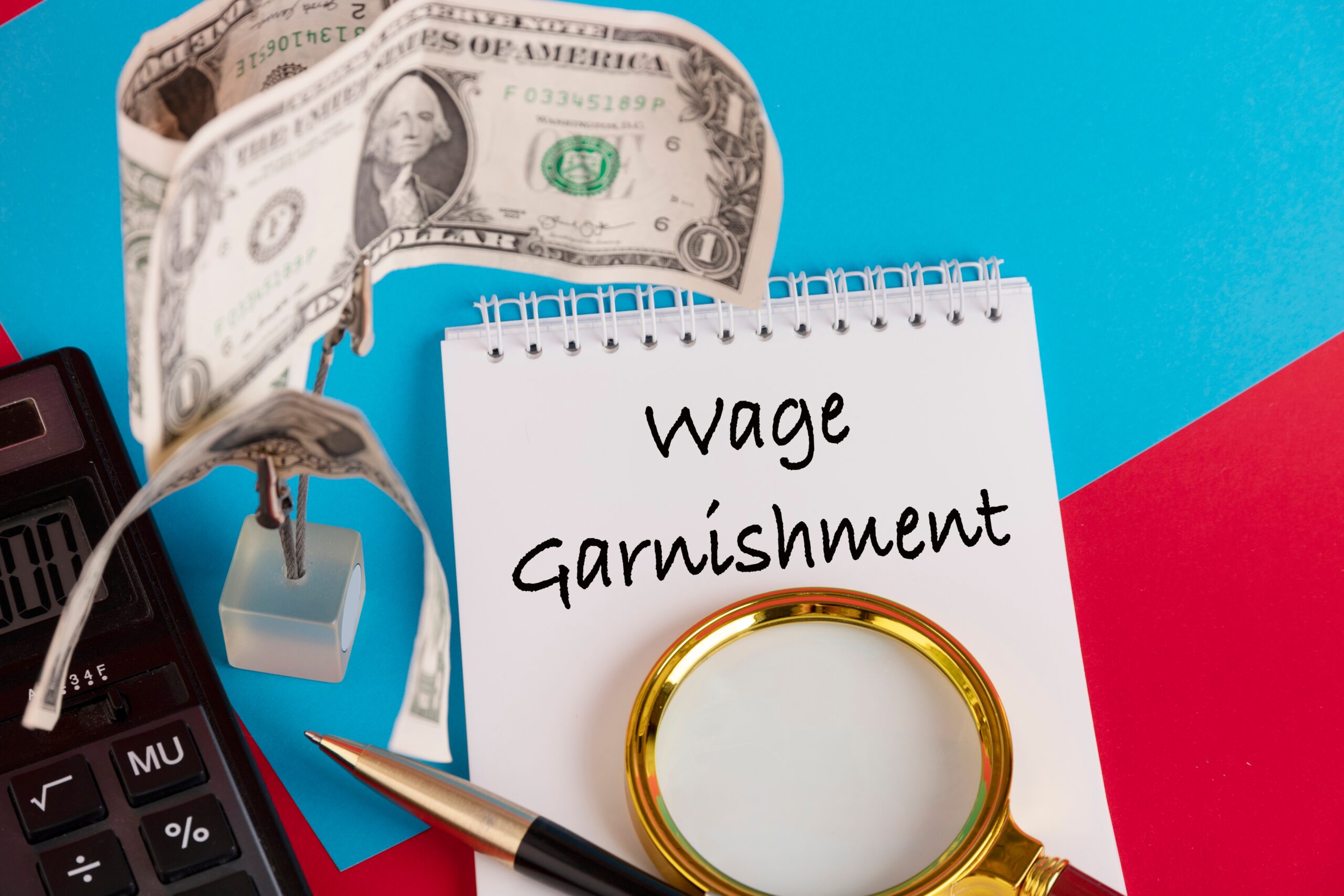 Paper with Wage Garnishment on a table