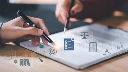 Businessman validates and manages business documents and agreements ,legal contract ,signing business contract approval ,joint venture agreement ,contract documents confirmation ,guarantee correctness