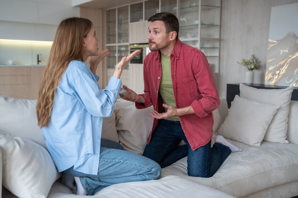Man woman quarrel over internet addiction and hanging in phone long time. Tired upset wife asking husband take his mind off smartphone. Marital discord, couple relationships, emotional conversation.