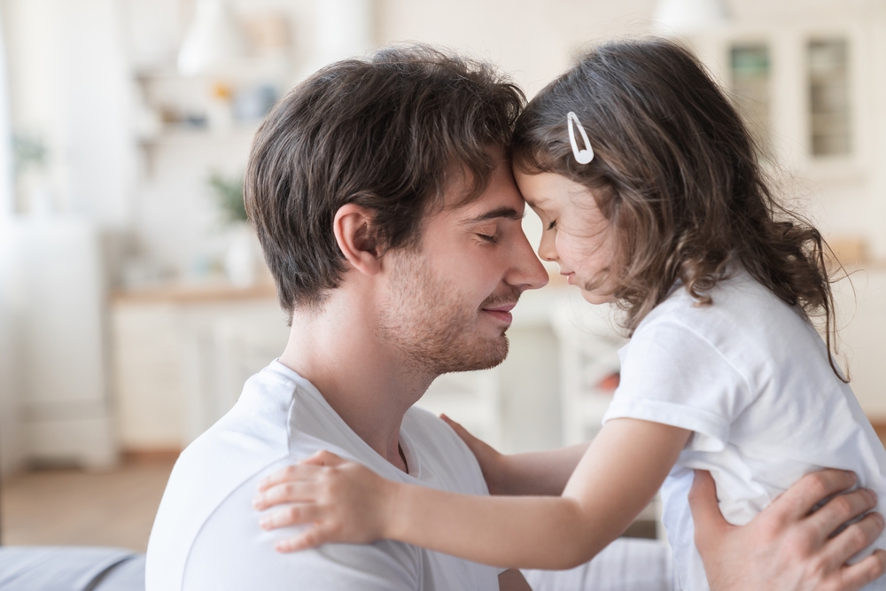 loving father, hugging his daughter lovingly