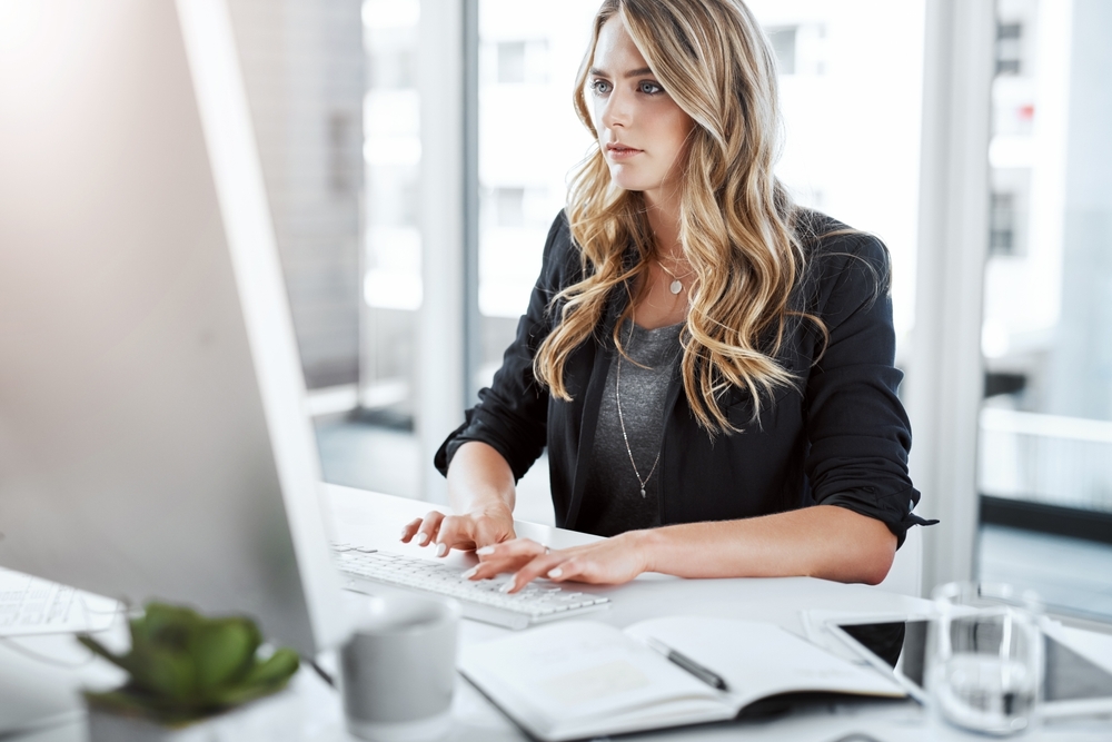 Attorney, woman and computer with report, legal documents and keyboard with contract for deal agreement. Lawyer, technology and notes for thinking