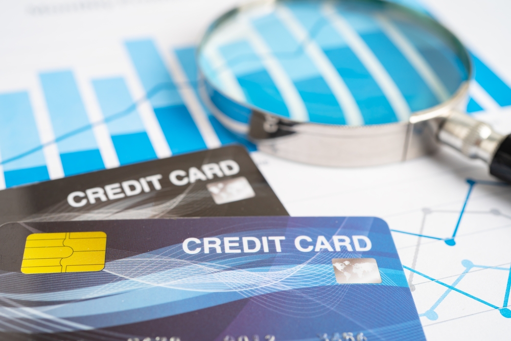 Credit card model on chart and graph spreadsheet paper. Finance development, Banking Account, Statistics, Investment Analytic research data economy, Stock exchange trading, Business company concept.