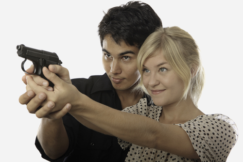 couple holding a gun, Texas divorce firearms