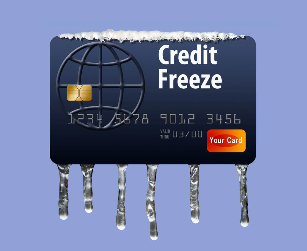 An image of a credit card that says credit freeze with ice sickles dripping down the credit card and some snow on the top 