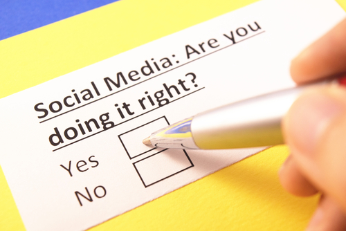 A hand holding a pen is about to check a box on a form asking, "Social Media: Are you doing it right?" with options for "Yes" and "No." Remember, during a custody battle, what you should not do is let social media judgments affect your decisions.