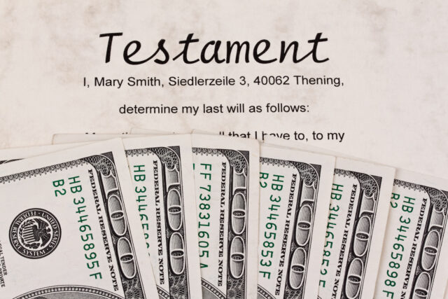 Document titled "testament" with text about the last will, accompanied by u.s. currency notes.