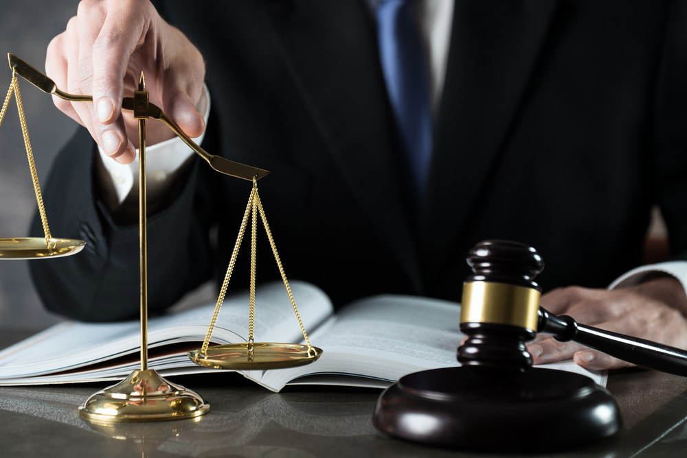 lawyer holding the justice in hand showing power of attorney 