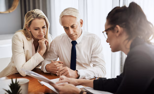 divorcing couple consulting with their divorce lawyer 