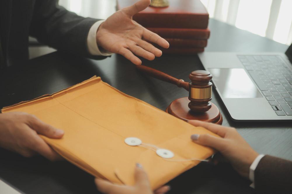 A lawyer handing over a gavel to a client.