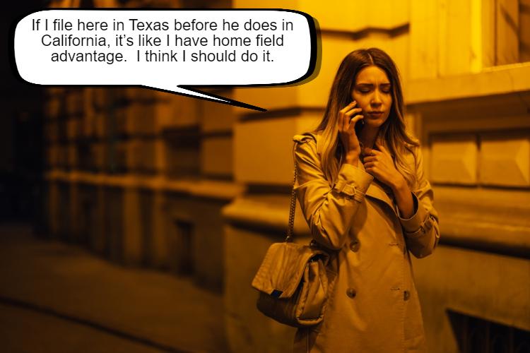 A woman in a beige trench coat talking on a mobile phone on a city street at night, appearing contemplative or concerned about whether she can file for divorce Texas before spouse files in California.