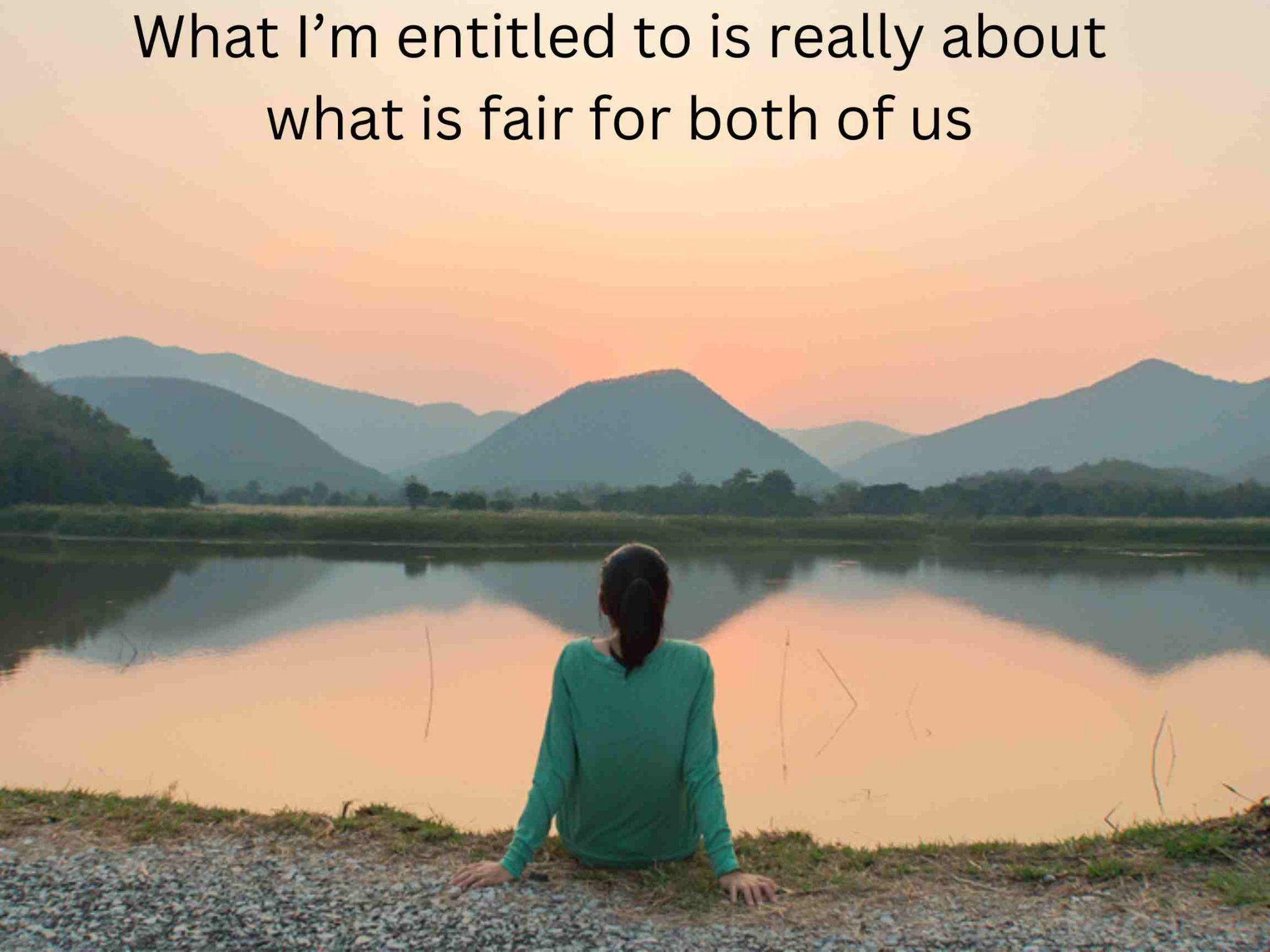 Person sitting by a tranquil lake with mountains in the background, contemplating key insights from a motivational quote overhead which is related to what a wife is entitled to in a divorce. 