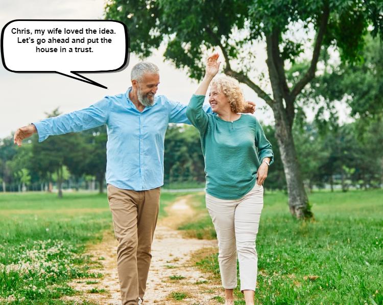 Couple walking in a park, holding hands with a speech bubble above the man saying, "Chris, my wife loved the idea.