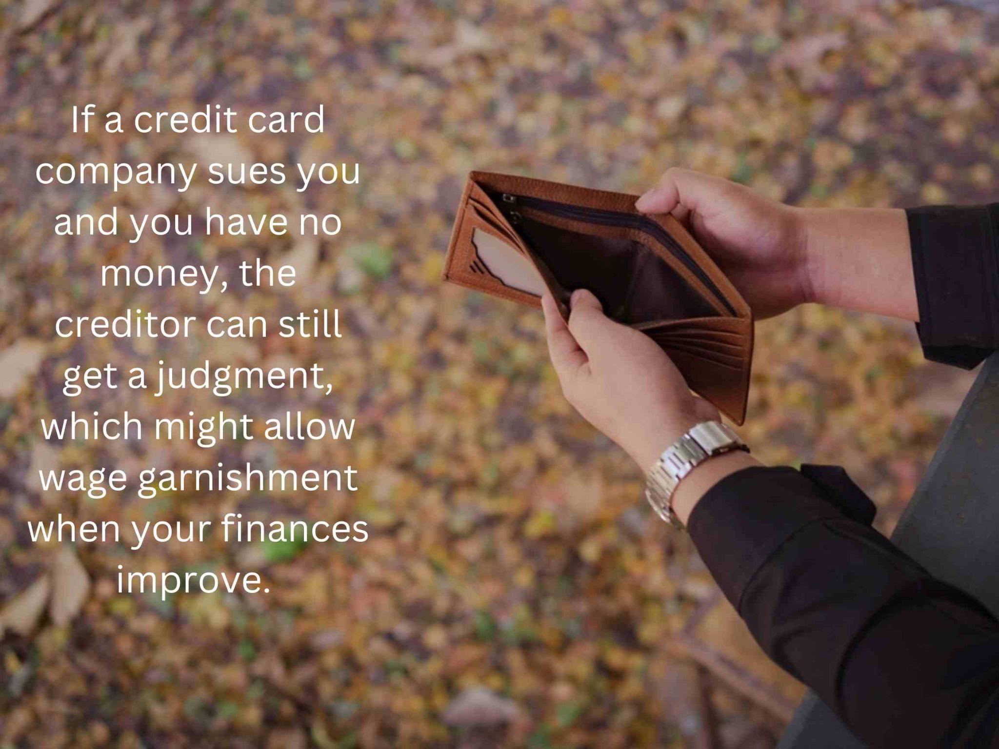 A person stands outdoors, clutching an empty wallet, pondering lawsuits and facing potential wage garnishment. 