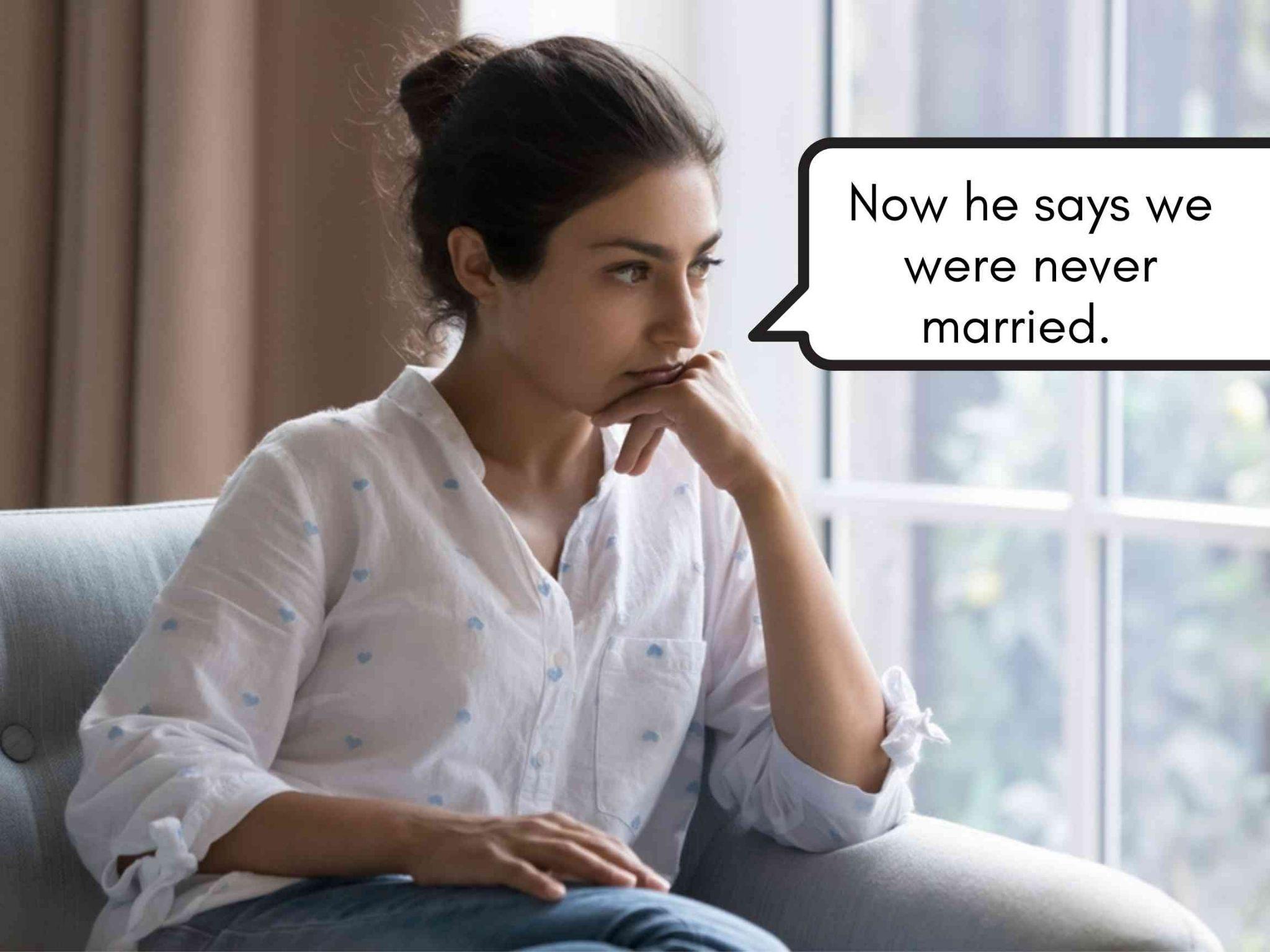A woman sits on a chair looking thoughtful and concerned, with a speech bubble that says, "Now he says we were never married.